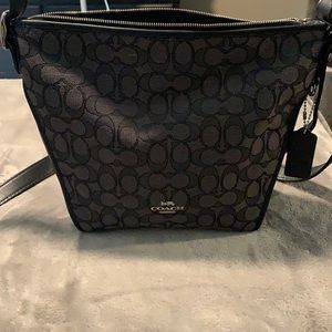 Beautiful black canvas/leather Coach purse.